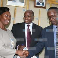 Justice and Constitutional Minister Martha Karua congratulate Dr Daniel Ichang'i (right)