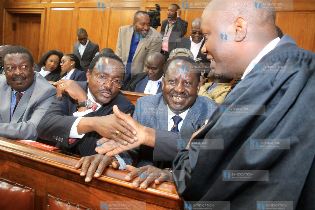 Raila Odinga (seated right), Kalonzo Musyoka (center)and Musalia Mudavadi