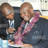 Vice President Moody Awori (right) consults with the Commissioner of Prisons, Gilbert Omondi