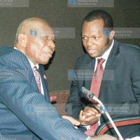 Vice President Moody Awori chats with Foreign Minister Mr. Raphael Tuju (right)