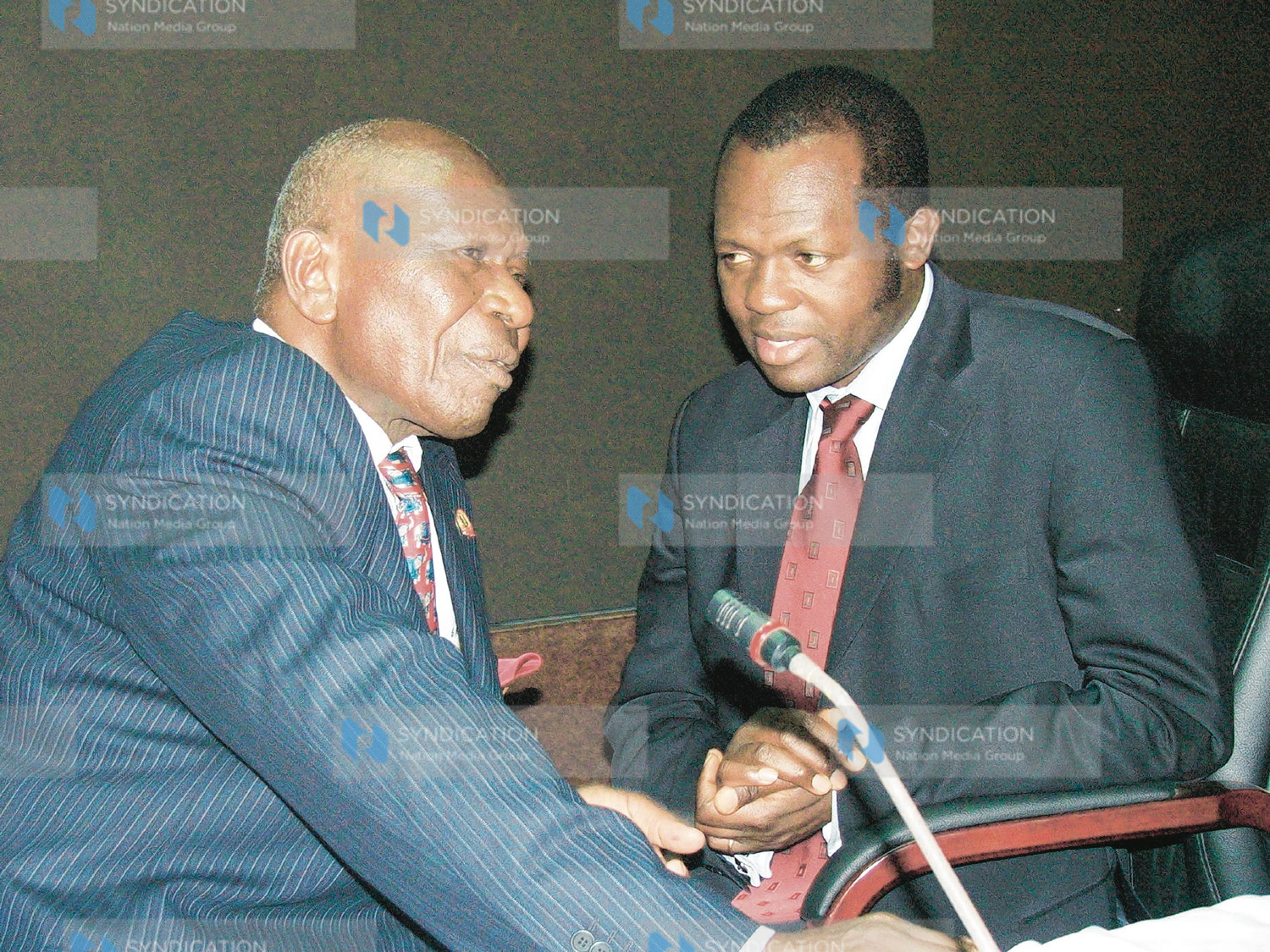 Vice President Moody Awori chats with Foreign Minister Mr. Raphael Tuju (right)