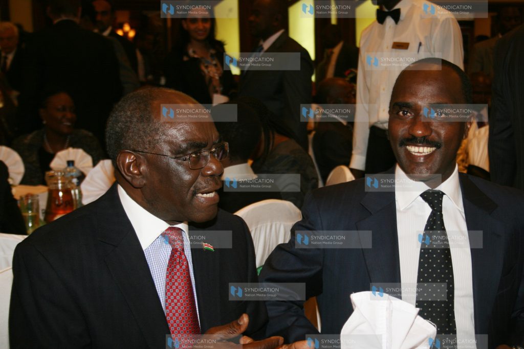 Assistant Minister David Musila (left) with Nation Media Group CEO Linus Gitahi