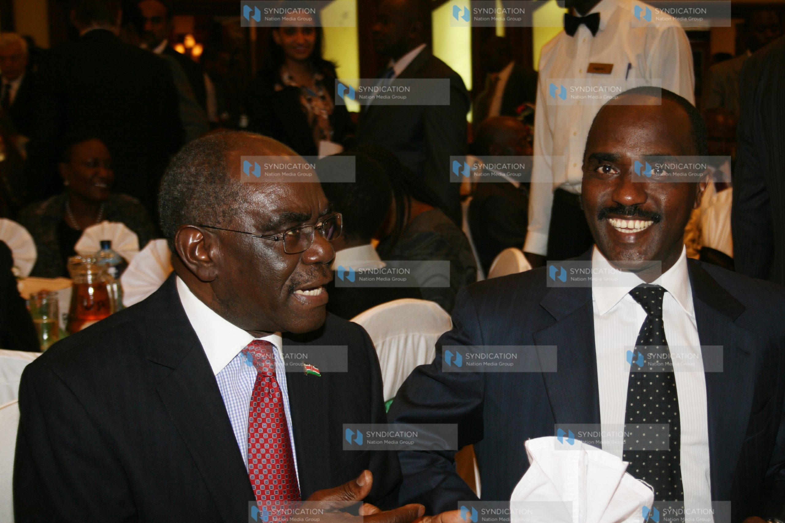 Assistant Minister David Musila (left) with Nation Media Group CEO Linus Gitahi