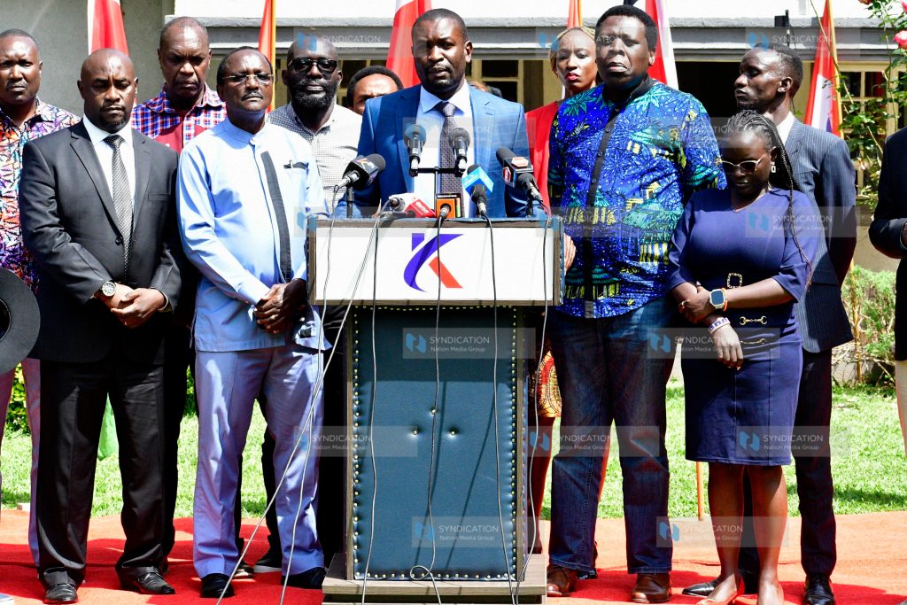 Edwin Sifuna (center, podium) addressing media at the SKM Center