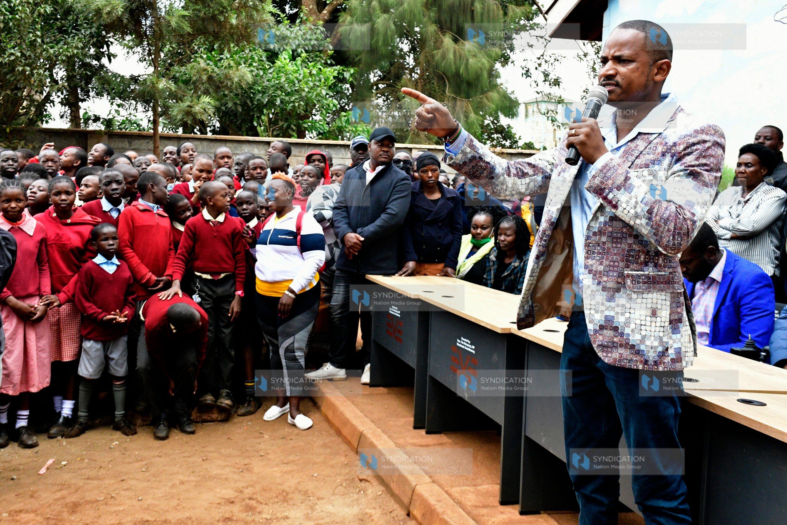 MP Babu Owino addressing students of New Kihumbuini Primary School in Kangemi