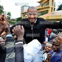 Babu Owino is held up by his supporters outside the Supreme Court