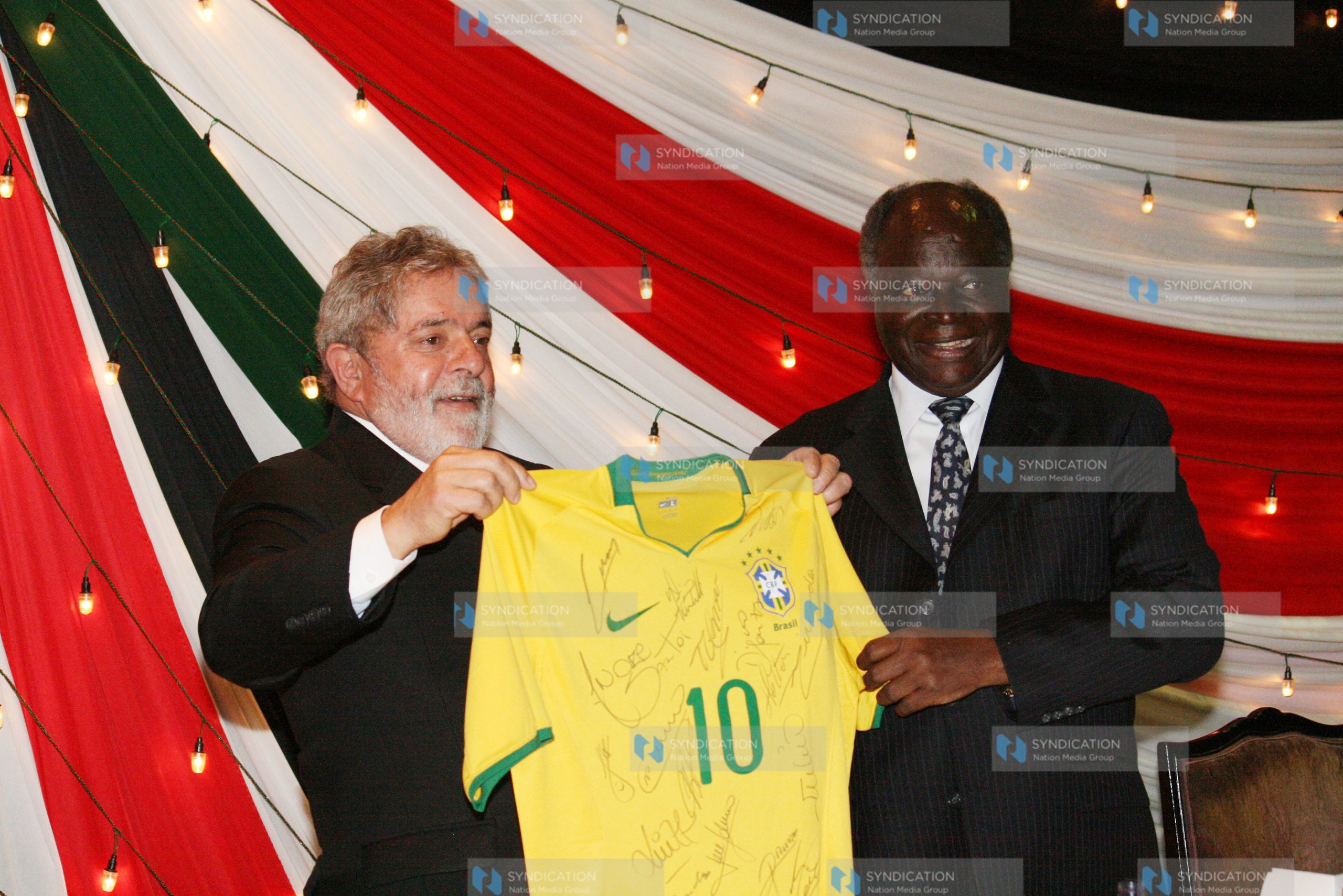 President Mwai Kibaki (right) receives a football jersey from Brazil President