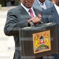Finance Minister Uhuru Kenyatta poses for photos