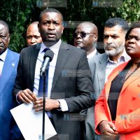 Edwin Sifuna (center) addressing a media briefing
