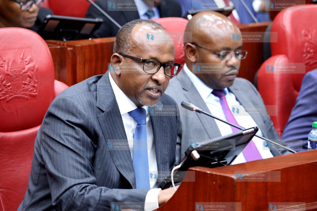 Aden Duale gestures as he addresses a joint Parliamentary committee