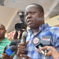 Dr Fred Matiang’i addresses students from Mama Ngina Girls School