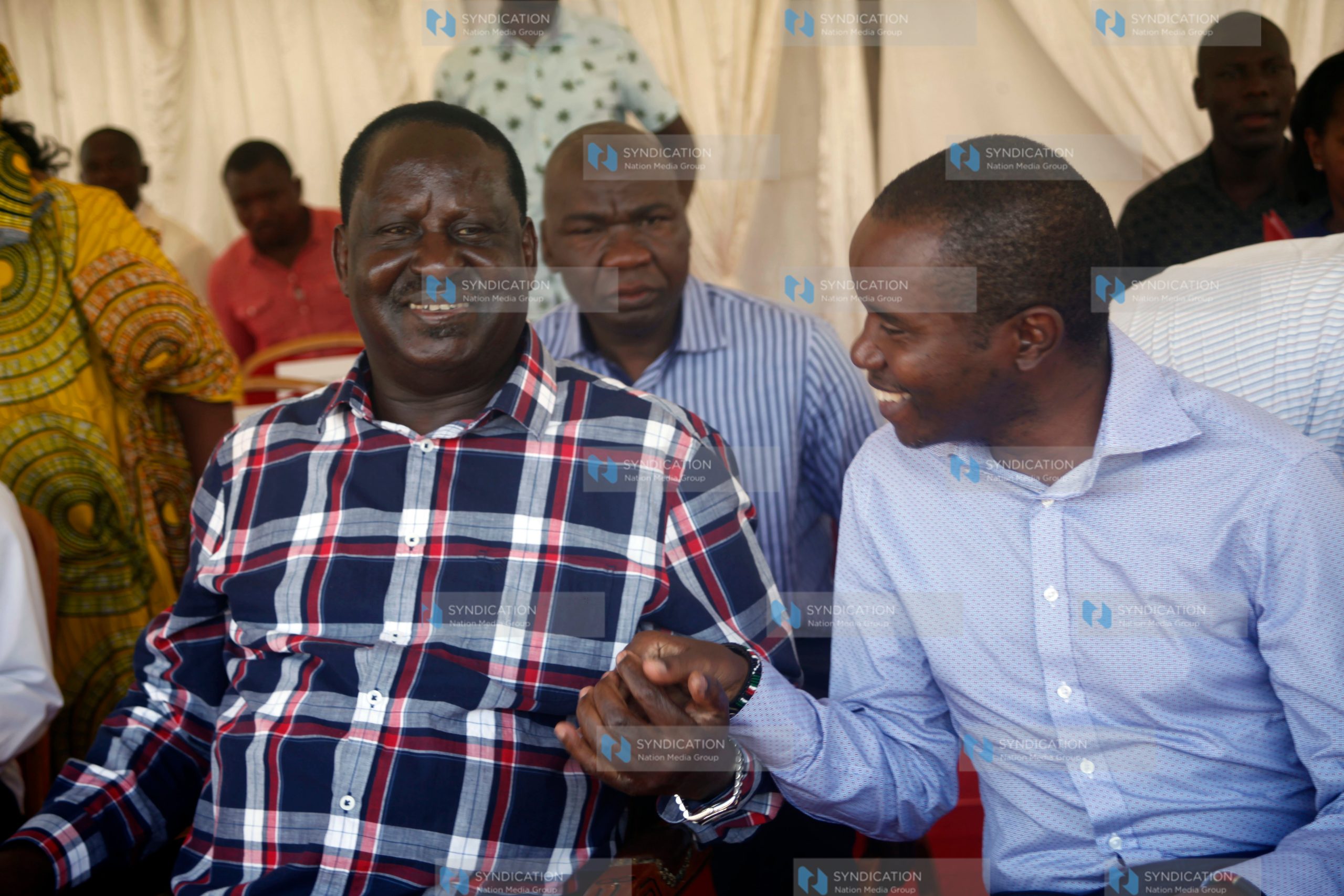 Former Prime Minister Raila Odinga speaks with ICT Cabinet Secretary Joe Mucheru