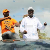ODM party leader Raila Odinga (right) is welcomed by Governor Hassan Joho