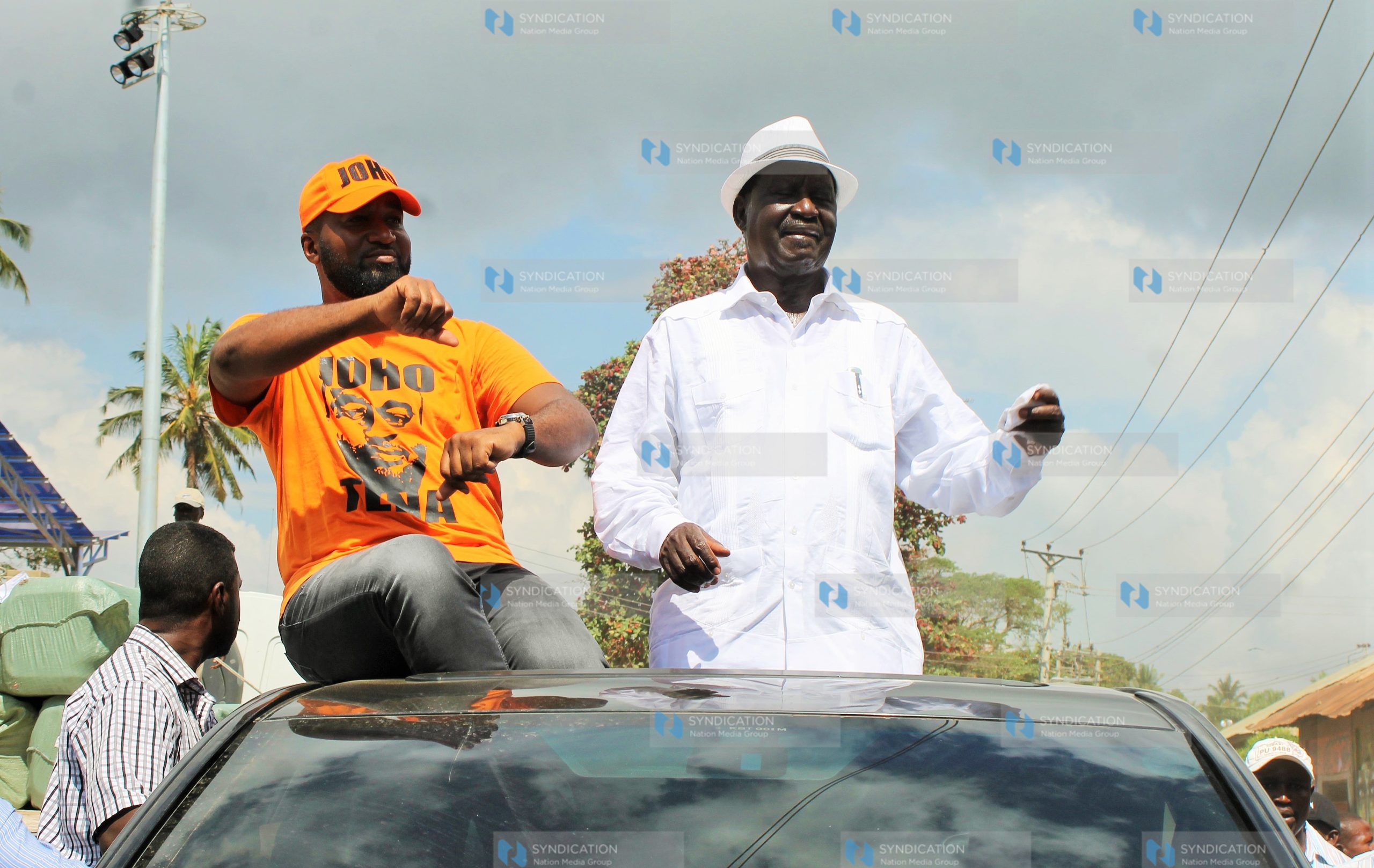 ODM party leader Raila Odinga (right) is welcomed by Governor Hassan Joho