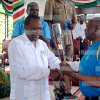 President Uhuru Kenyatta hands over the Queen's Barton