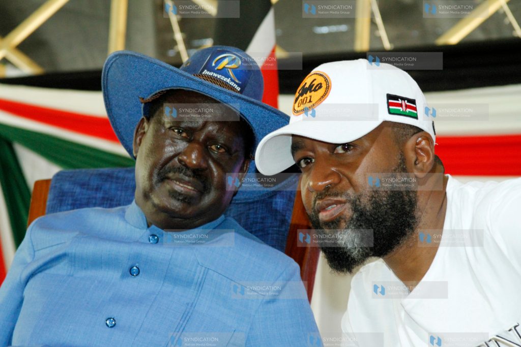 Raila Odinga with Mombasa Governor Hassan Joho addressing delegates