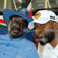 Raila Odinga with Mombasa Governor Hassan Joho addressing delegates