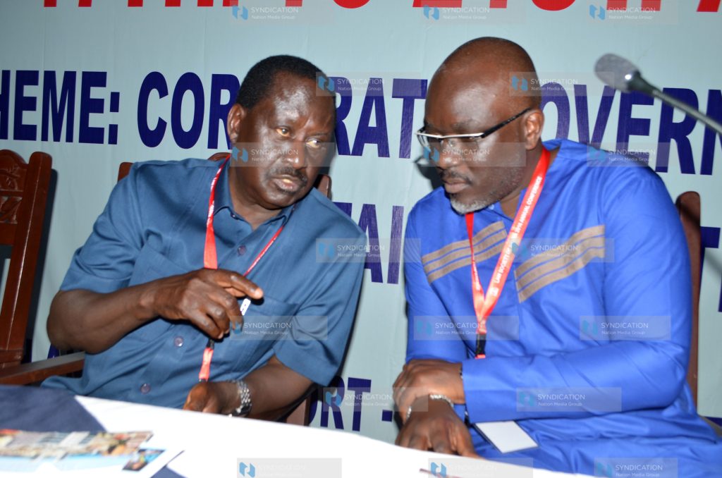 Raila Odinga confers with Law Society of Kenya President Isaac Okero (right)