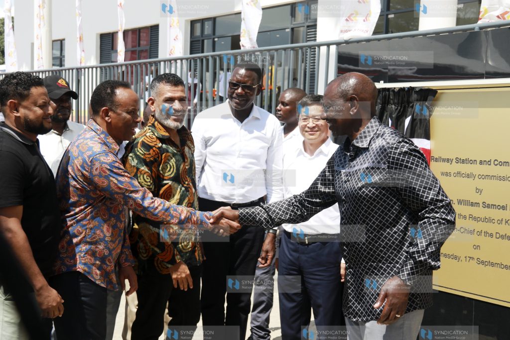 President William Ruto shakes hands with Abdi Duale
