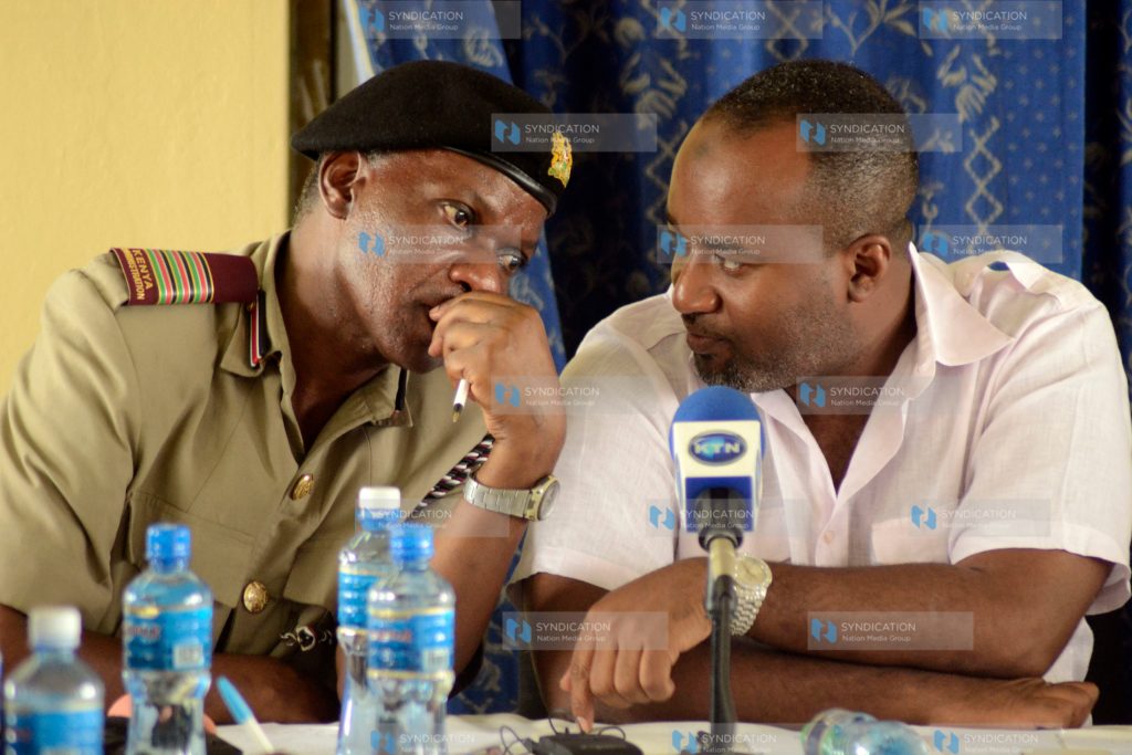 Hassan Joho shares a word with County Commissioner Nelson Marwa