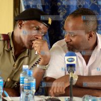 Hassan Joho shares a word with County Commissioner Nelson Marwa