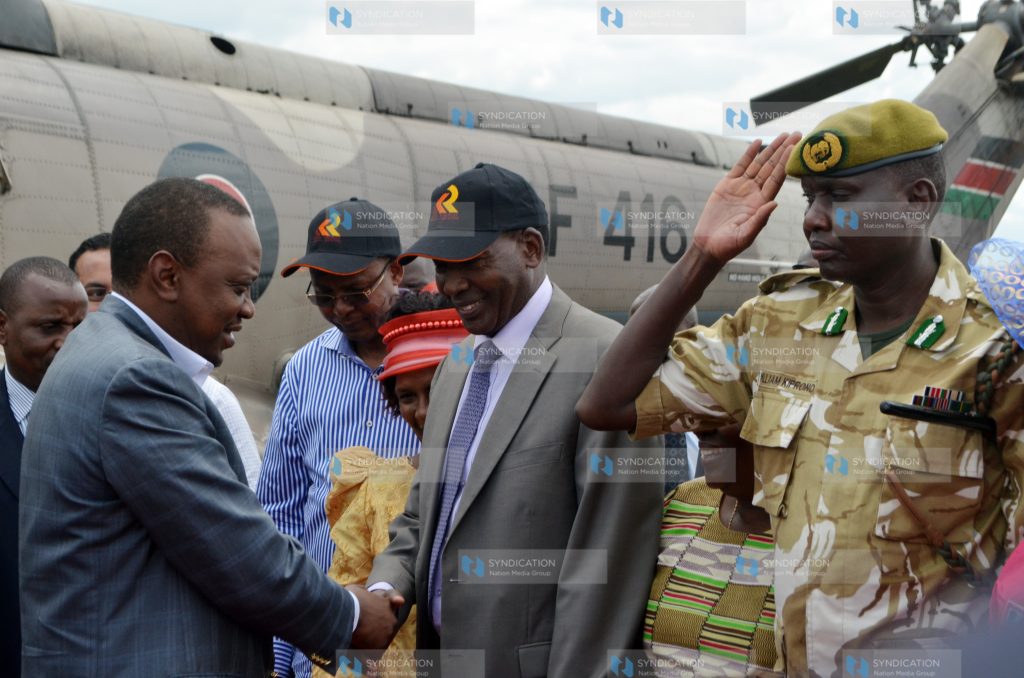 President Uhuru Kenyatta greets Interior Cabinet Secretary Joseph Nkaissery