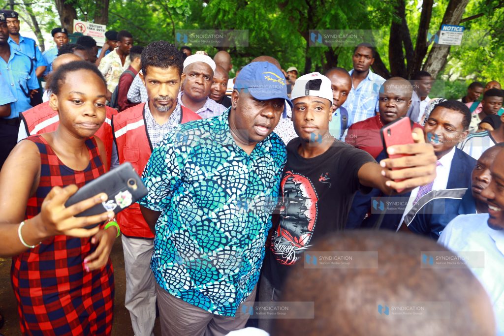 CS Dr. Fred Matiang'i take selfie with the youths