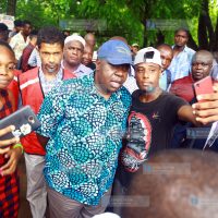 CS Dr. Fred Matiang'i take selfie with the youths