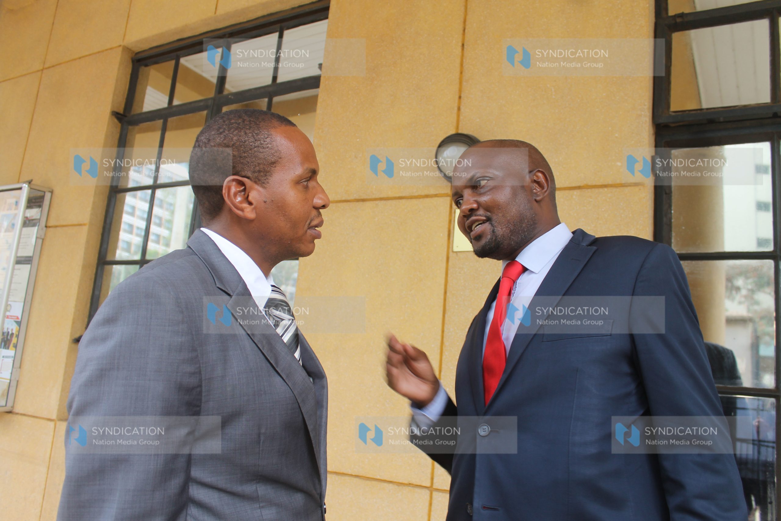 Gatundu South MP Moses Kuria consults with his lawyer Danson Mungatana