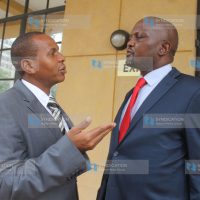 Gatundu South MP Moses Kuria consults with his lawyer Danson Mungatana