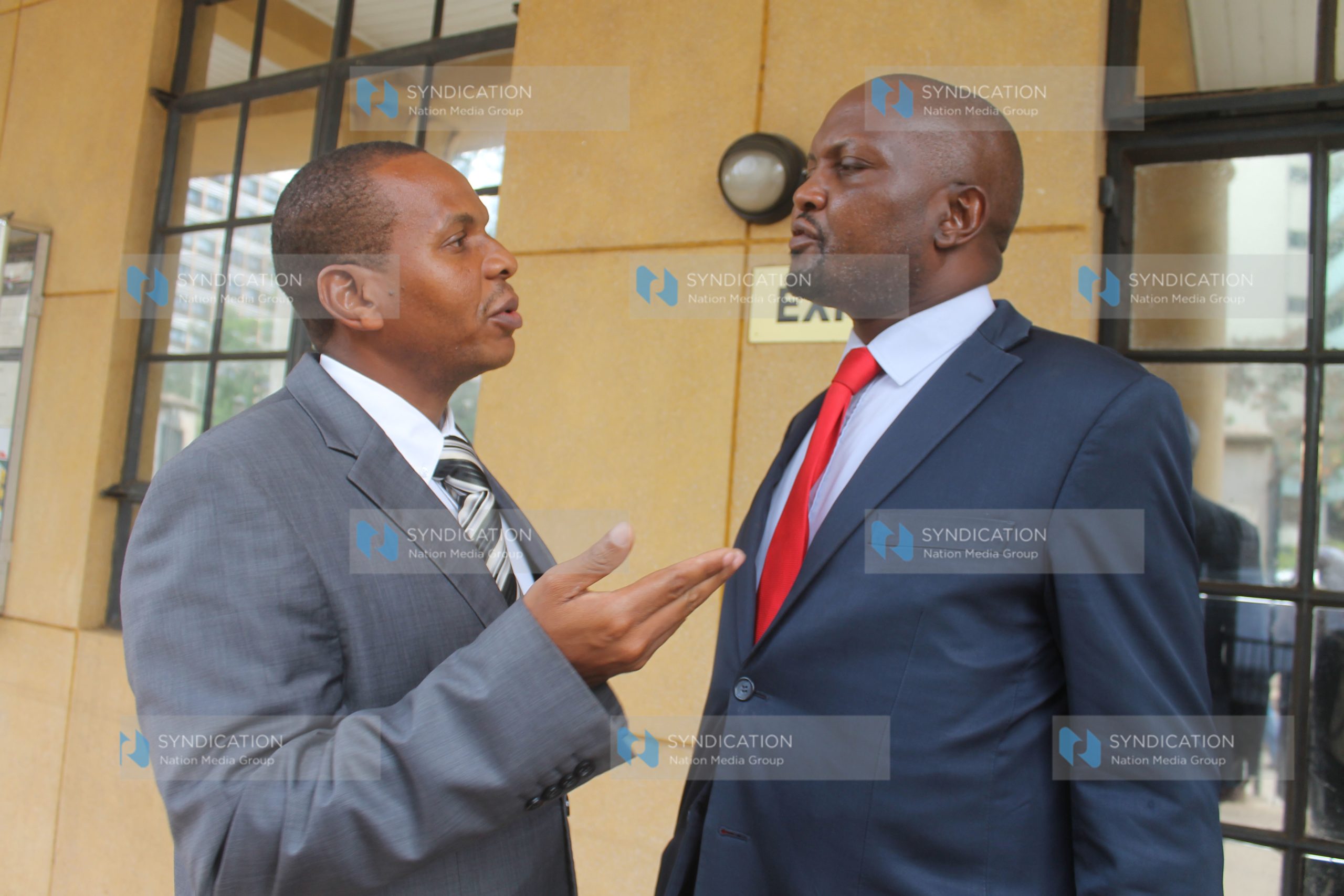 Gatundu South MP Moses Kuria consults with his lawyer Danson Mungatana