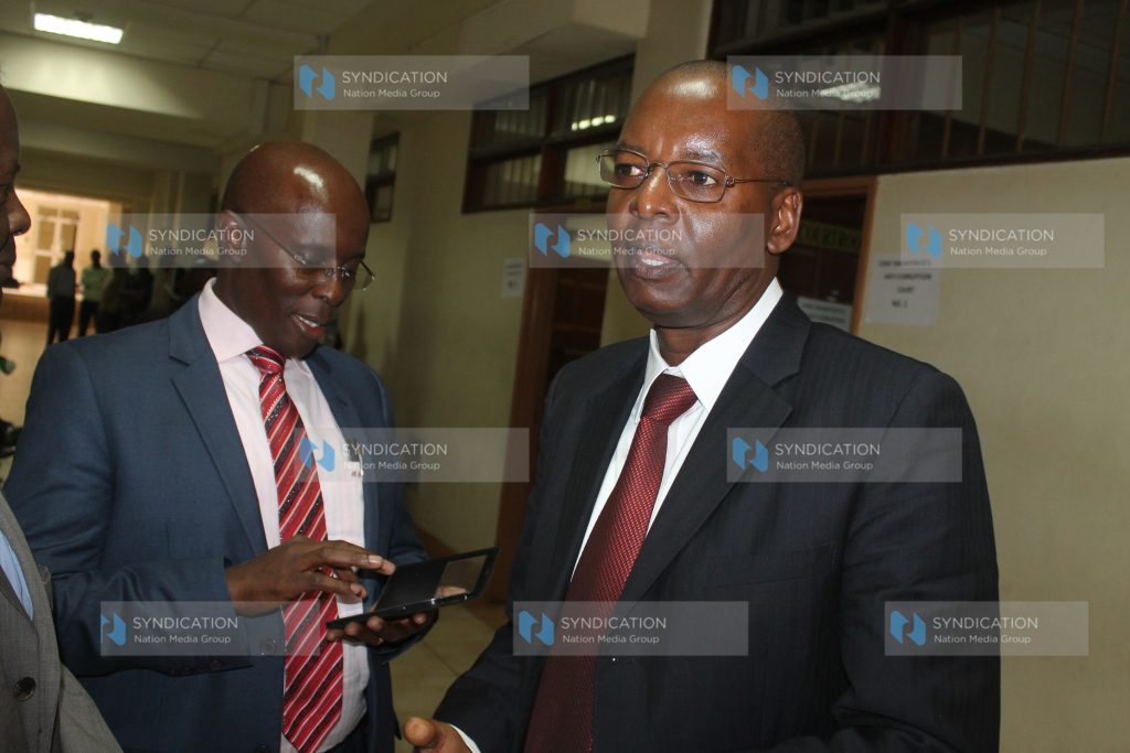 Former Lands Minister Amos Kimunya with his lawyer Mwaniki Gachoka