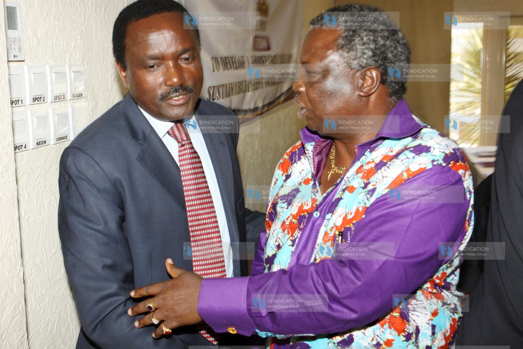 Vice president Kalonzo Musyoka (left), chats with COTU Secretary General Francis Atwoli