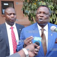 Francis Atwoli with lawyer Charles Omanga addressing the media