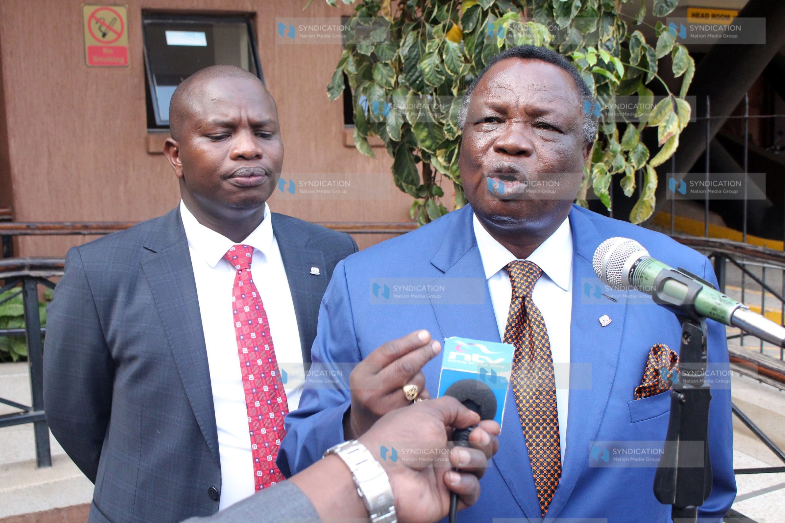 Francis Atwoli with lawyer Charles Omanga addressing the media