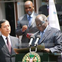 President Mwai Kibaki presents a donation of US $1 Million to Japanese ambassador Toshihisa Takata