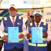 Wilber Ottichilo displaying Memorandum of understanding (MOU)