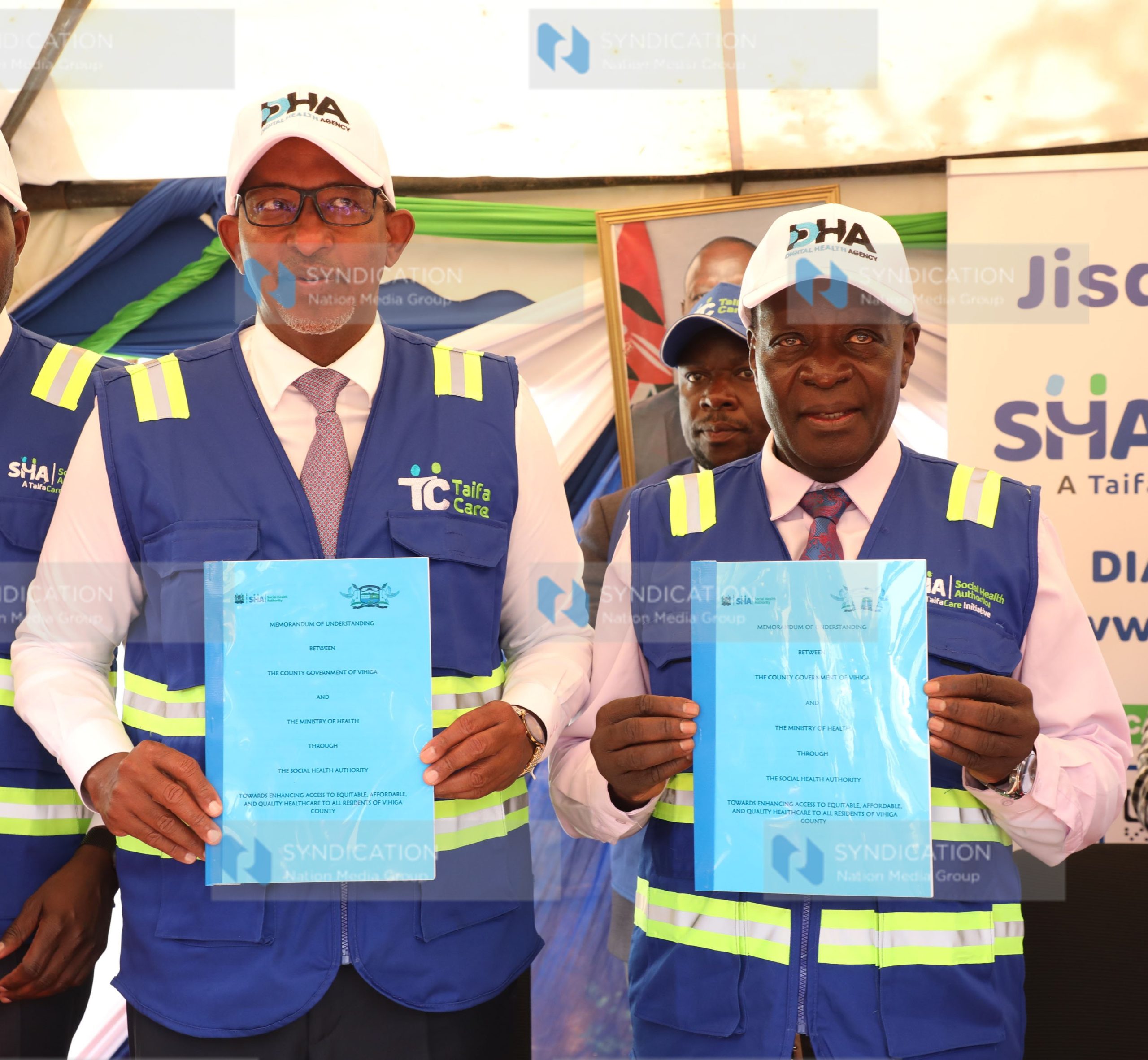 Wilber Ottichilo displaying Memorandum of understanding (MOU)