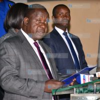 Dr. Fred Matiang'i (left) addressing media
