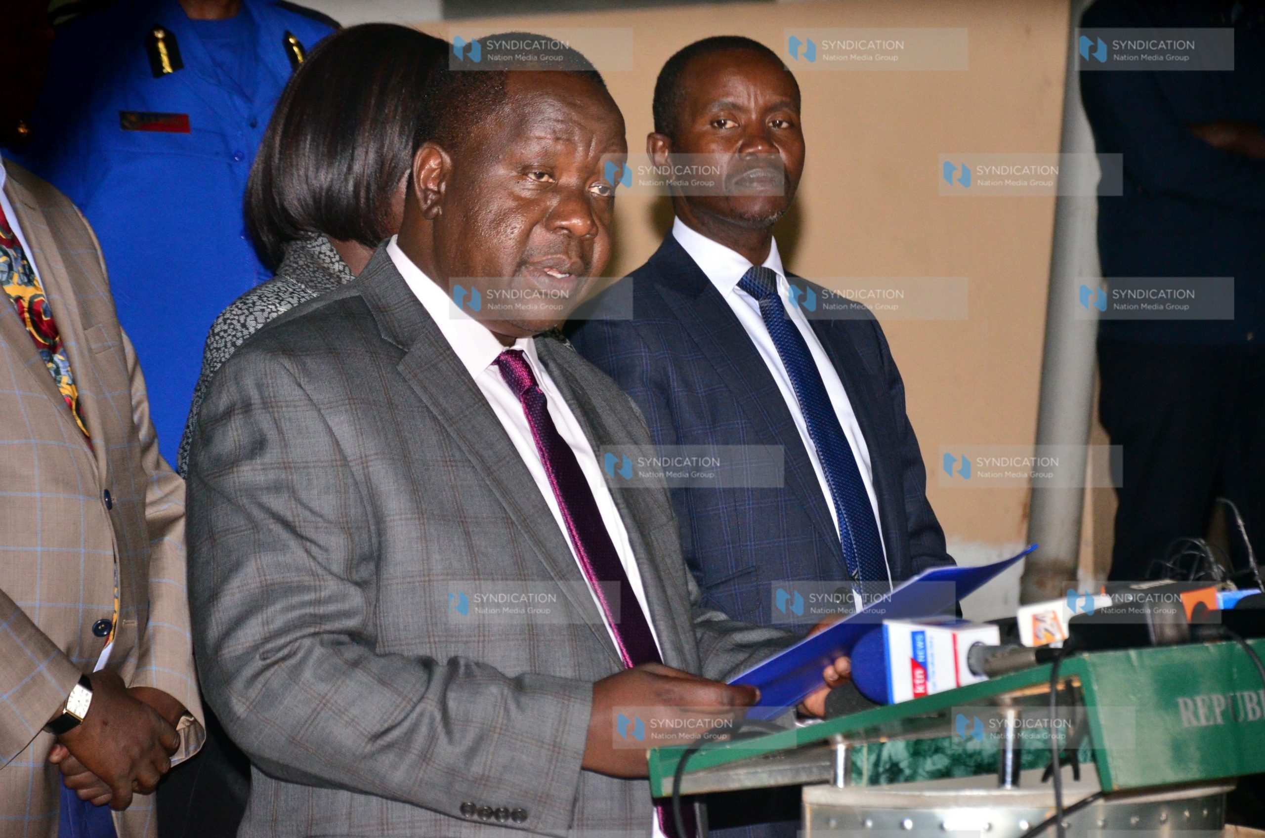 Dr. Fred Matiang’i (left) addressing media