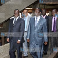 Prime Minister Raila Odinga leaves with Minister for Energy Kiraitu Murungi