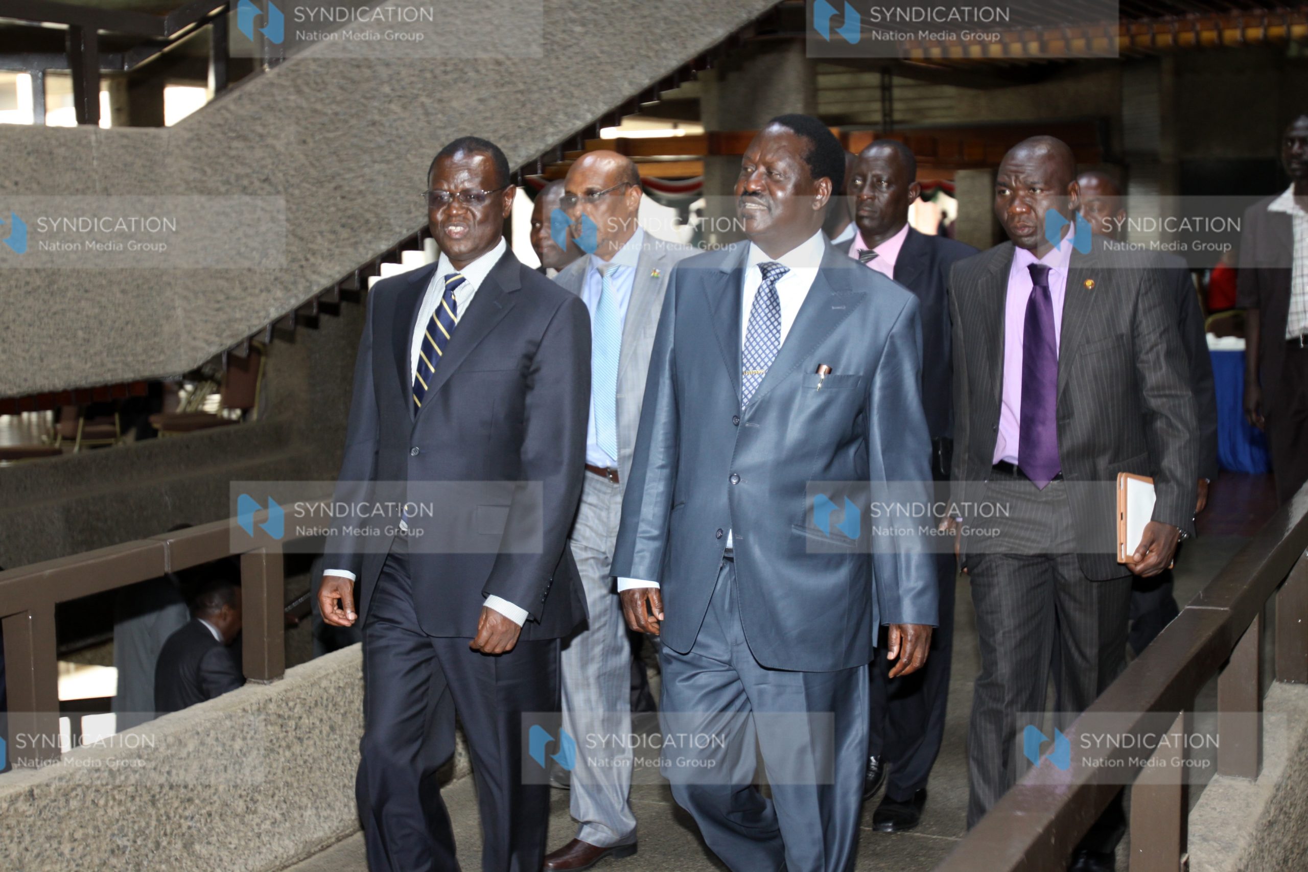 Prime Minister Raila Odinga leaves with Minister for Energy Kiraitu Murungi