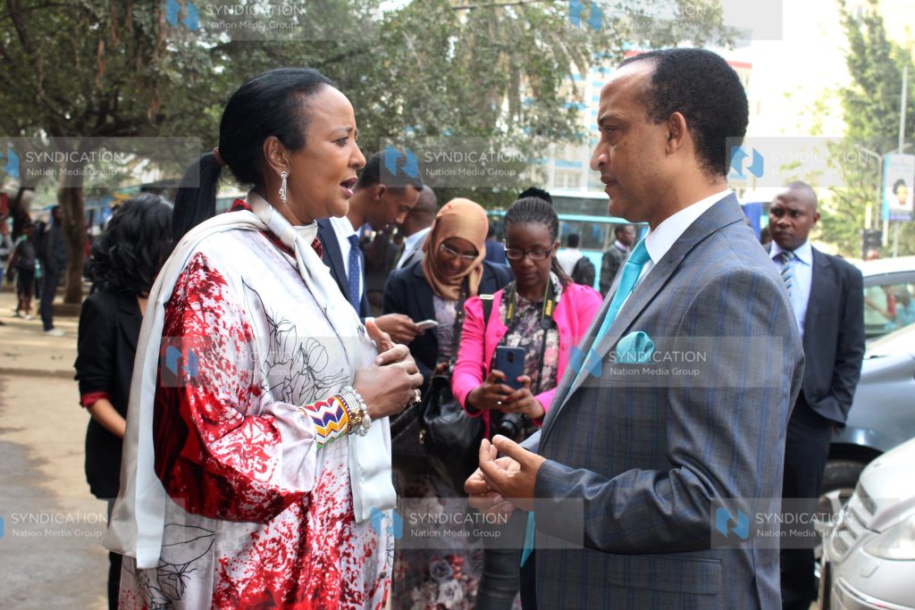 Ambassador of the federal Democratic Republic of Ethiopia to Kenya H.E. Meles Alem (right) chats with Sports CS Amina Mohamed