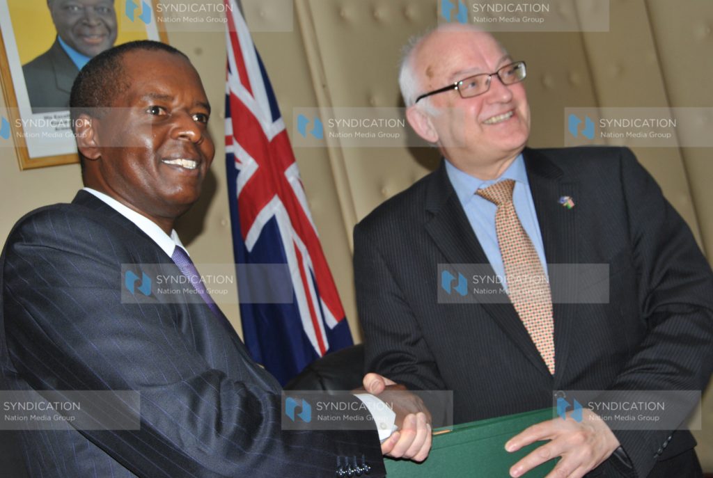 A special envoy of Australia's Prime Minister Bob MC Mullan with Kenya's Transport minister Amos Kimunya