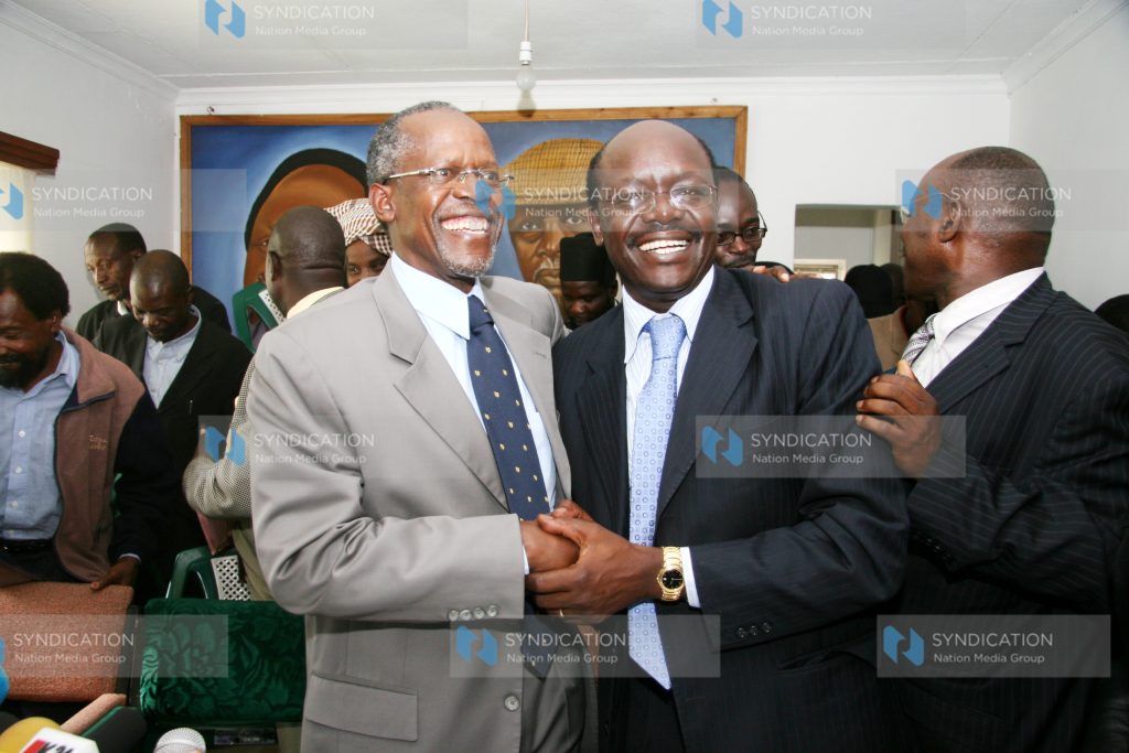 Ford-Kenya National chairman Musikari Kombo smiles as he receives Mukhisa Kituyi
