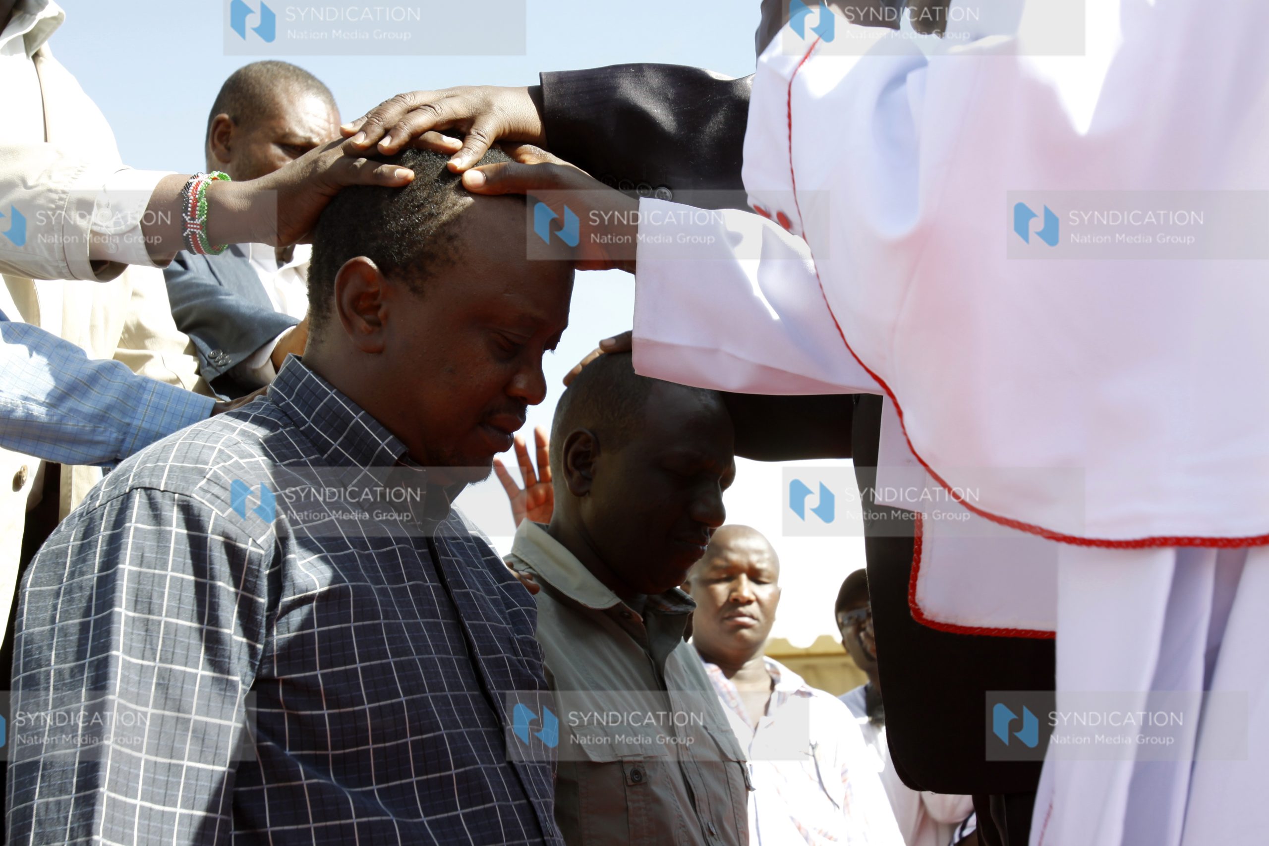 Uhuru Kenyatta and William Ruto receive prayers