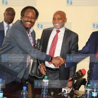 Meru Governor Kiraitu Murungi shakes hands with Meru Ministers Forum Chairman Bishop Edward Buria