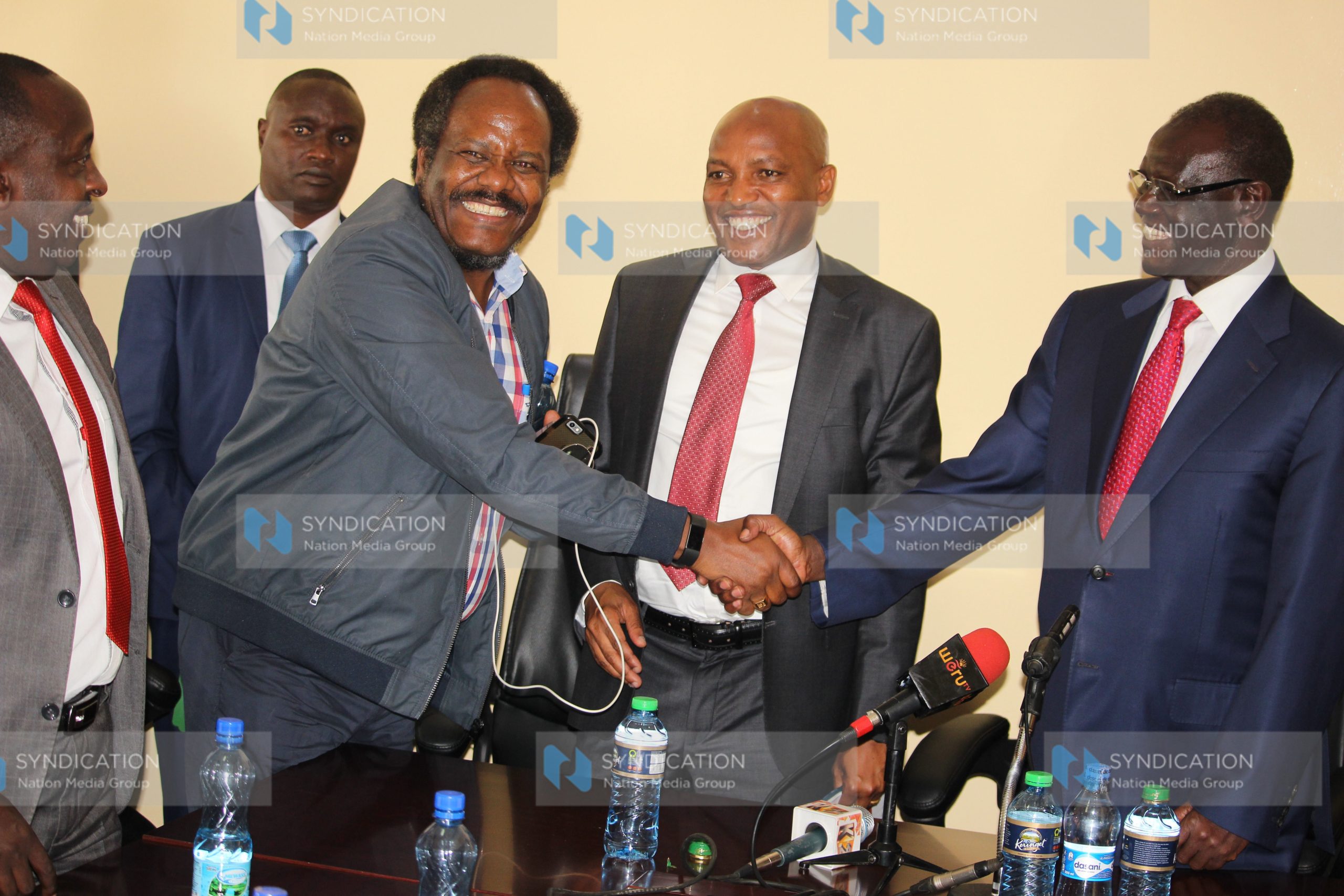 Meru Governor Kiraitu Murungi shakes hands with Meru Ministers Forum Chairman Bishop Edward Buria