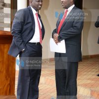 Deputy President William Ruto conversing with Meru Governor Peter Munya