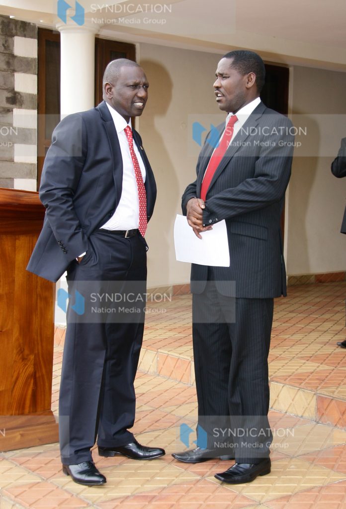 Deputy President William Ruto conversing with Meru Governor Peter Munya